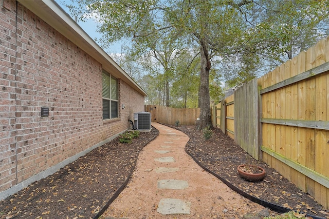 view of yard with central air condition unit