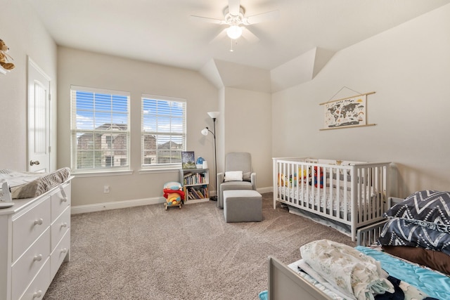 bedroom featuring ceiling fan, carpet flooring, and a nursery area