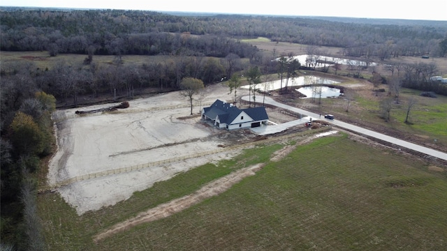 bird's eye view with a water view and a rural view