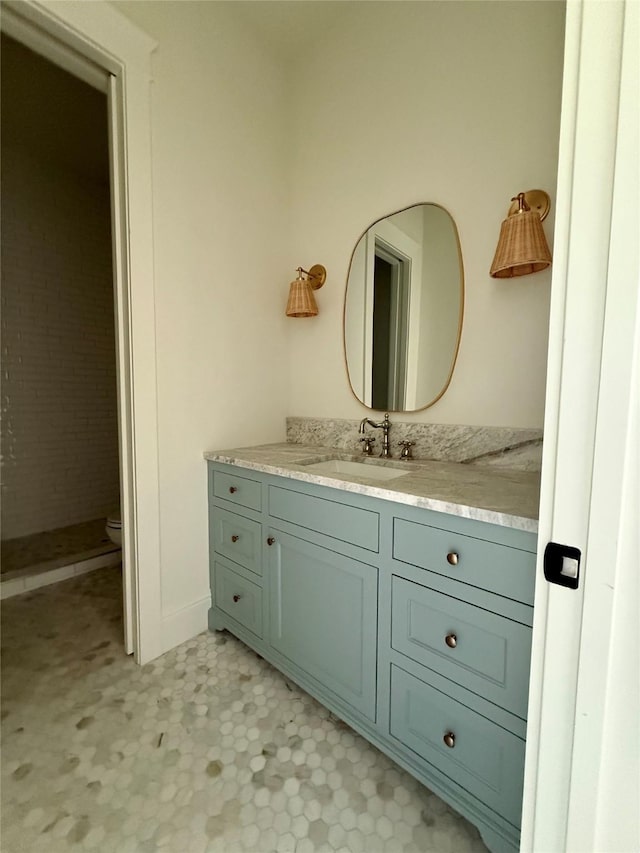 bathroom with toilet and vanity