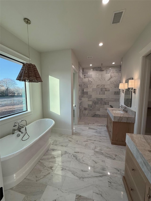 bathroom featuring vanity and separate shower and tub