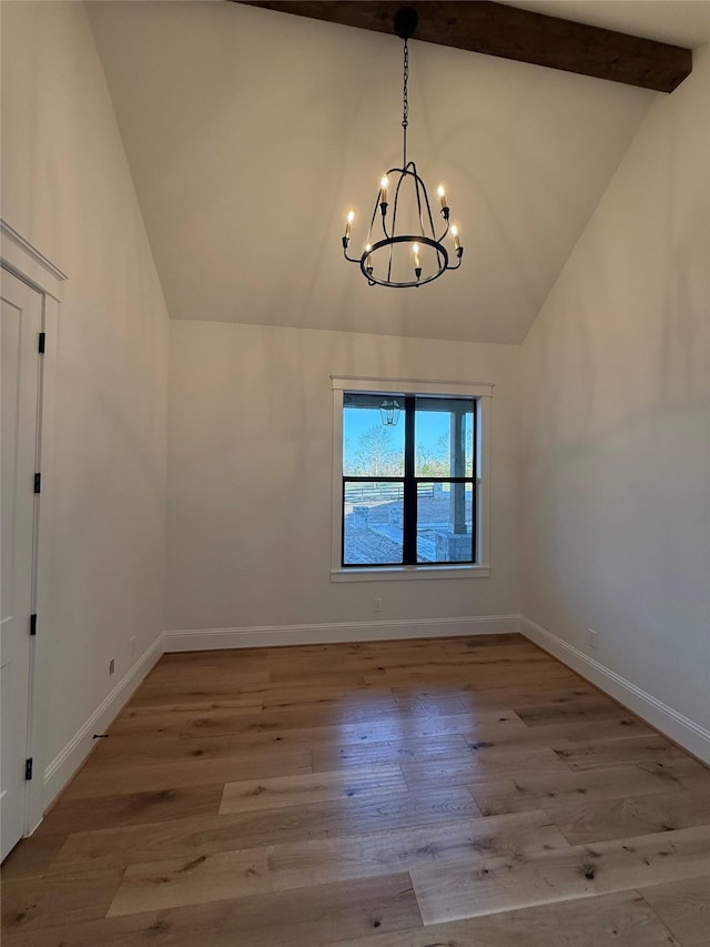 unfurnished dining area featuring an inviting chandelier, high vaulted ceiling, beam ceiling, and light hardwood / wood-style floors