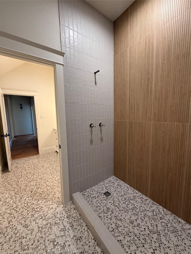 bathroom with tiled shower