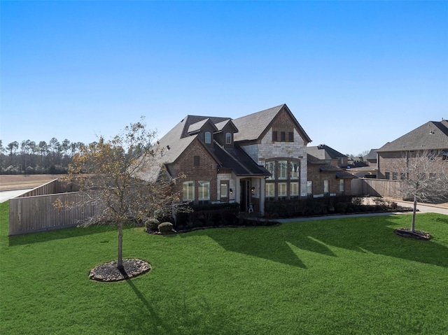 view of front of home with a front lawn