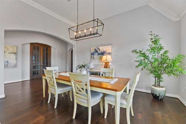 dining room featuring crown molding, vaulted ceiling, and dark wood-type flooring