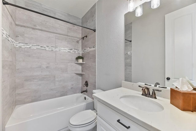 full bathroom featuring vanity, toilet, and tiled shower / bath combo