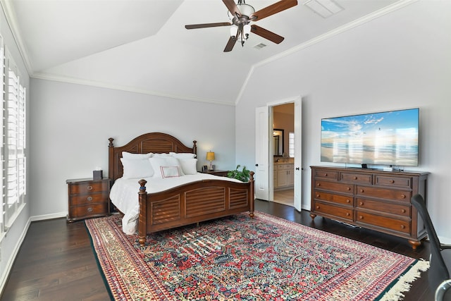 bedroom featuring lofted ceiling, dark hardwood / wood-style floors, connected bathroom, and ceiling fan