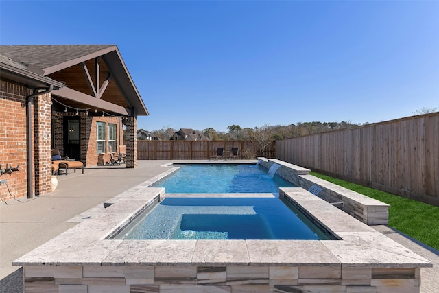 view of pool featuring an in ground hot tub and a patio area