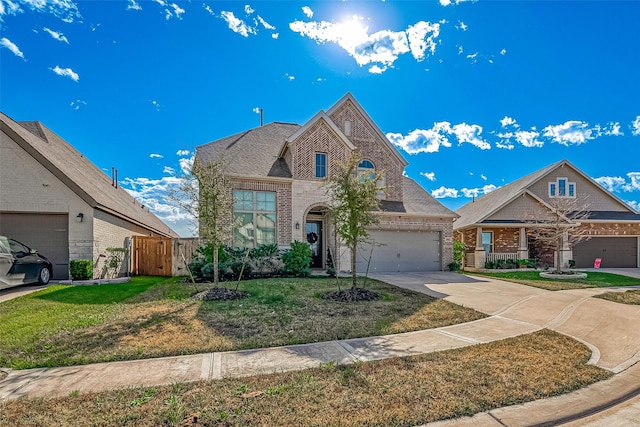 view of front of home with a garage and a front lawn