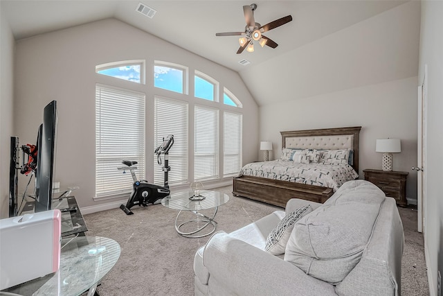 carpeted bedroom with ceiling fan and lofted ceiling