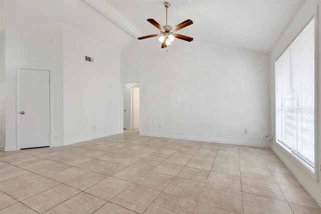 spare room featuring ceiling fan, light tile patterned floors, beam ceiling, and high vaulted ceiling