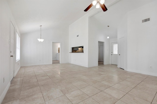 unfurnished living room featuring ceiling fan, light tile patterned floors, and high vaulted ceiling