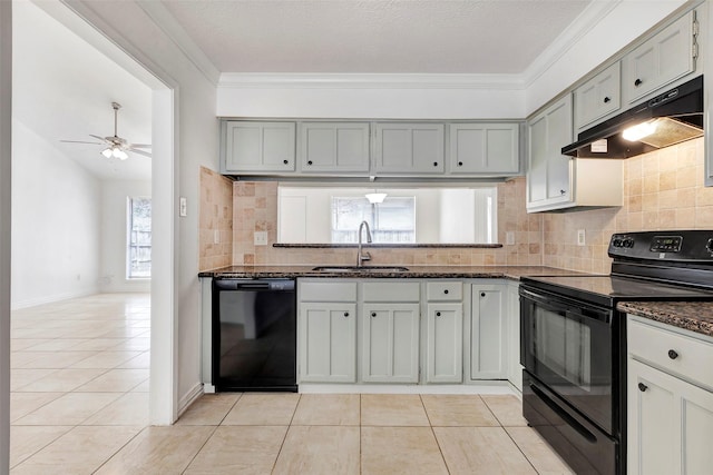 kitchen featuring light tile patterned floors, ceiling fan, tasteful backsplash, black appliances, and sink