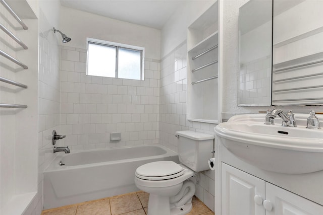 full bathroom featuring tiled shower / bath combo, tile patterned floors, vanity, and toilet