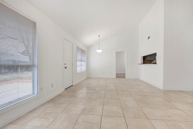 tiled foyer with lofted ceiling and a wealth of natural light