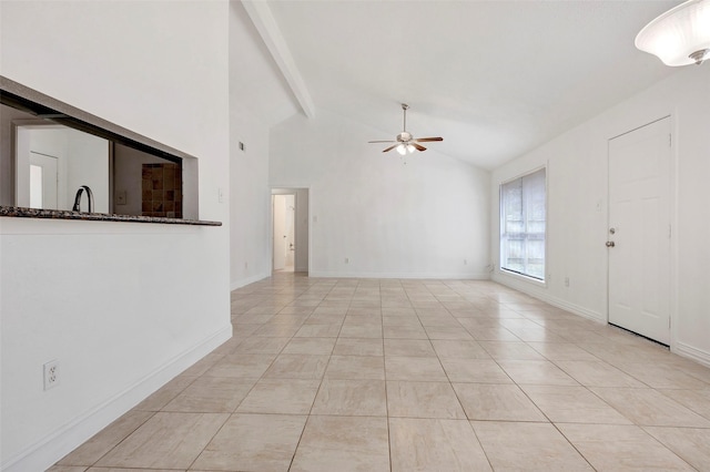 unfurnished living room with ceiling fan, light tile patterned flooring, vaulted ceiling with beams, and sink