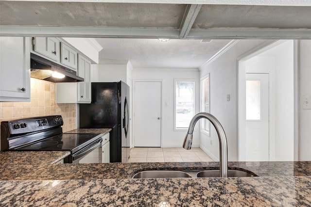 kitchen featuring black appliances, decorative backsplash, sink, ornamental molding, and light tile patterned floors