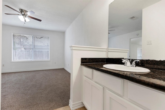 bathroom featuring ceiling fan and vanity