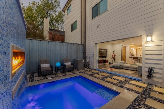 view of pool featuring a patio and pool water feature