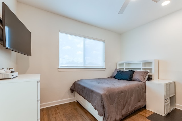 bedroom featuring light wood-type flooring and ceiling fan