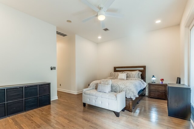 bedroom with ceiling fan and light hardwood / wood-style floors