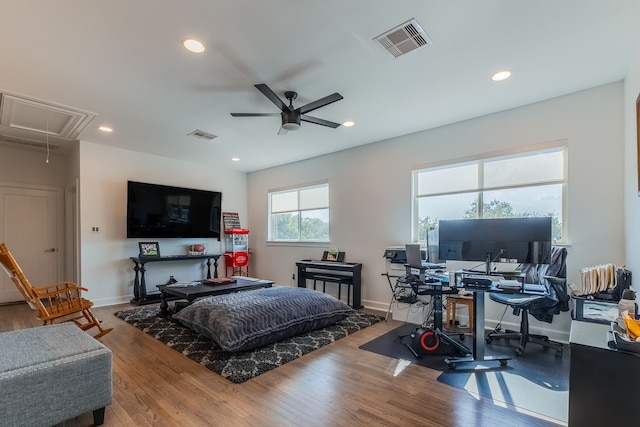 interior space with ceiling fan and hardwood / wood-style floors