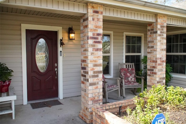 property entrance with covered porch