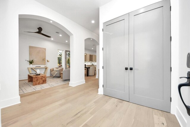 entrance foyer featuring ceiling fan and light wood-type flooring