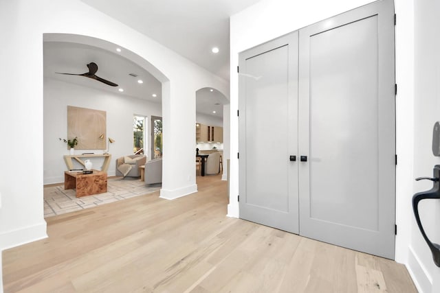 entryway featuring ceiling fan and light wood-type flooring