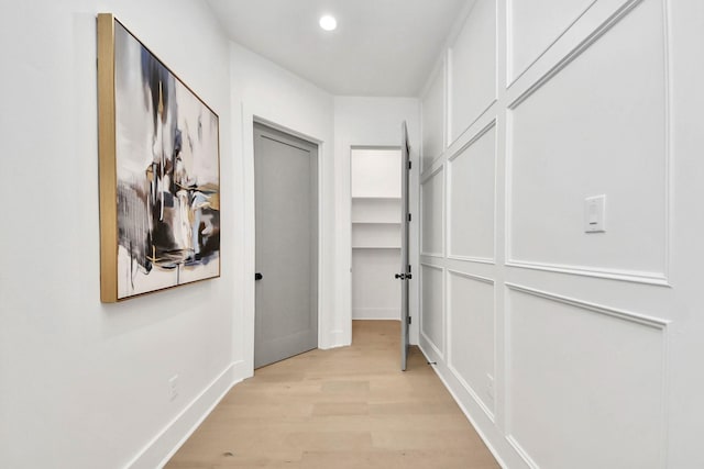 hall with light wood-type flooring