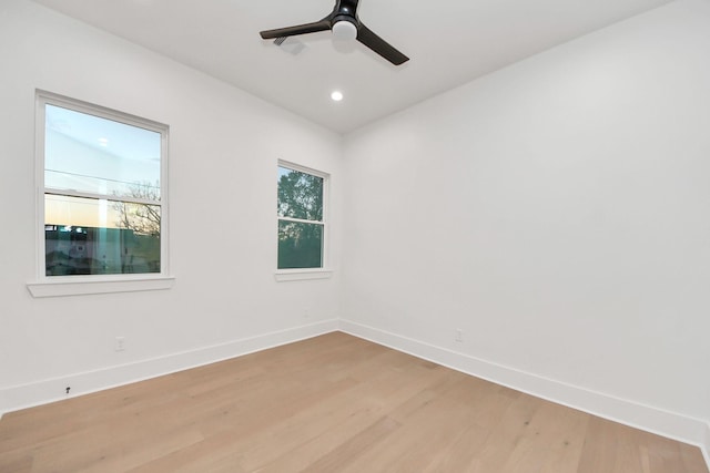 spare room with ceiling fan and light hardwood / wood-style floors