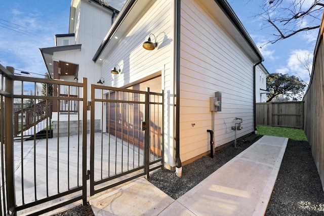 view of side of property with a patio