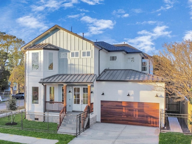 modern farmhouse with a garage and a front yard