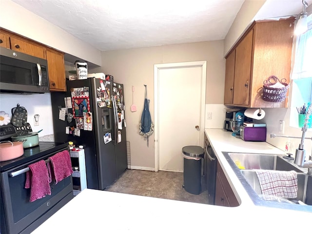 kitchen with appliances with stainless steel finishes and sink