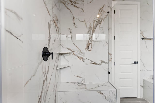 bathroom featuring tiled shower