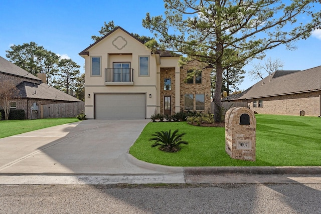 view of front of home with a front yard, a balcony, and a garage