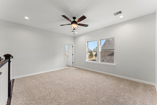 unfurnished room featuring carpet floors and ceiling fan