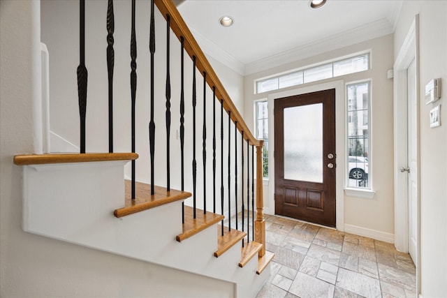 foyer featuring ornamental molding