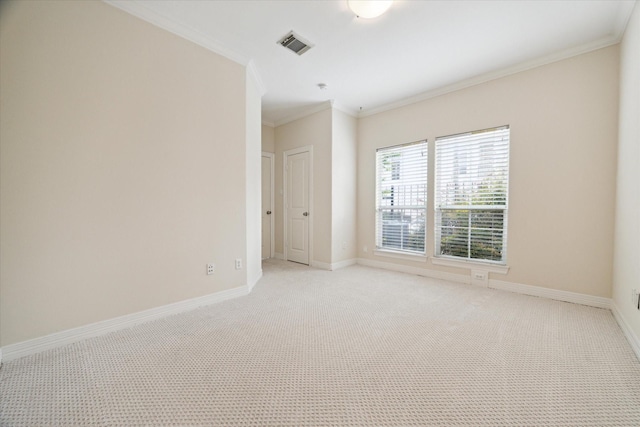 carpeted spare room with ornamental molding