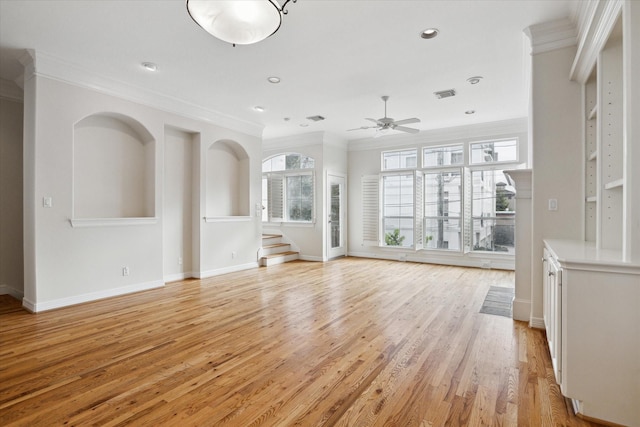 unfurnished living room with light hardwood / wood-style floors, ornamental molding, and ceiling fan