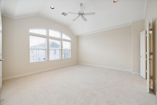 carpeted spare room with crown molding, lofted ceiling, and ceiling fan