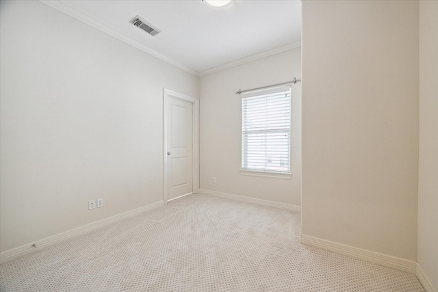 carpeted spare room with ornamental molding