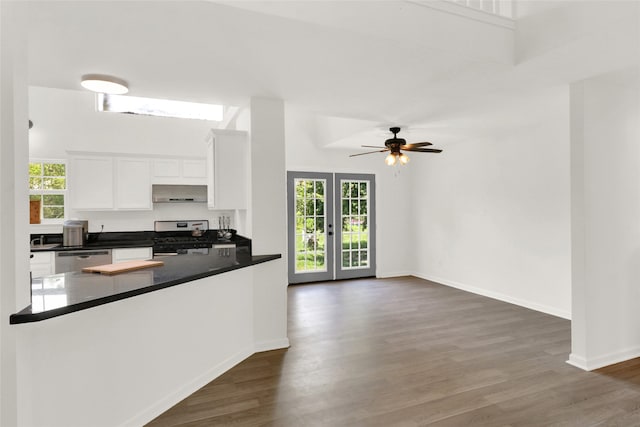 kitchen featuring white cabinetry, dark hardwood / wood-style flooring, stainless steel appliances, french doors, and ceiling fan