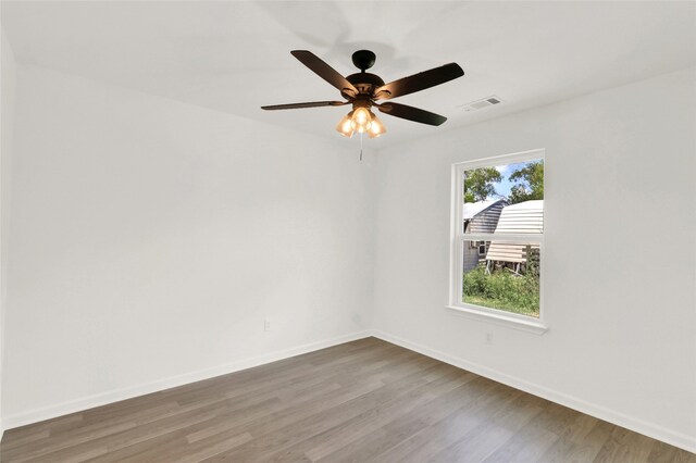 spare room featuring ceiling fan and hardwood / wood-style floors