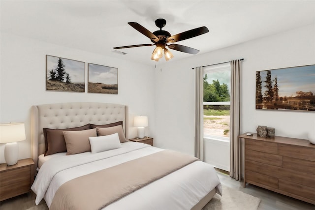 bedroom featuring ceiling fan and light hardwood / wood-style floors