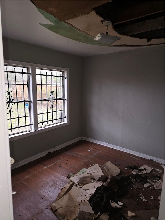 spare room featuring dark hardwood / wood-style flooring