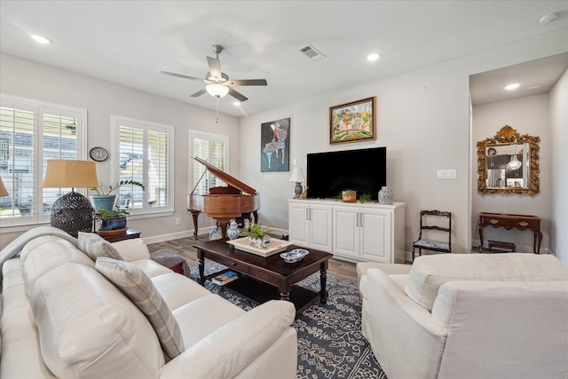 living room featuring plenty of natural light, hardwood / wood-style floors, and ceiling fan