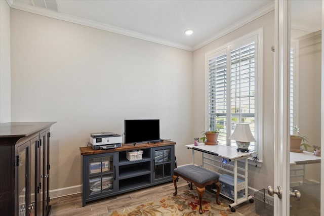 office area featuring hardwood / wood-style flooring and crown molding