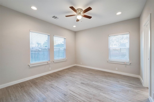 unfurnished room featuring ceiling fan and light hardwood / wood-style flooring