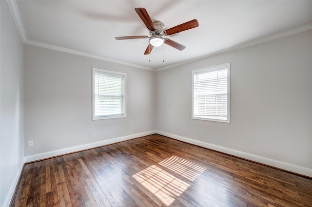 empty room featuring ceiling fan, plenty of natural light, ornamental molding, and dark hardwood / wood-style floors